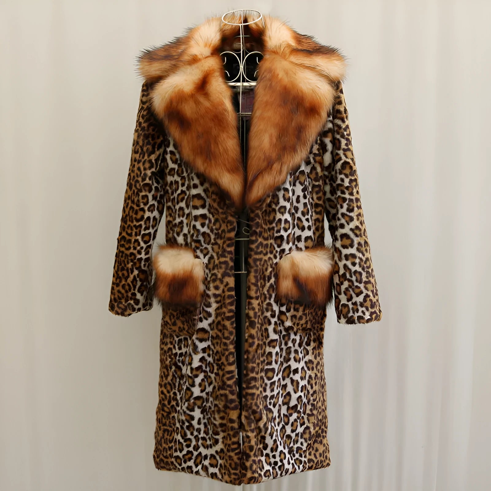 Long leopard print artificial fur jacket with regular sleeves on a hanger.