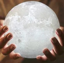 3D printed moon lamp with lunar surface detail on wooden stand, showing touch metal ring at base