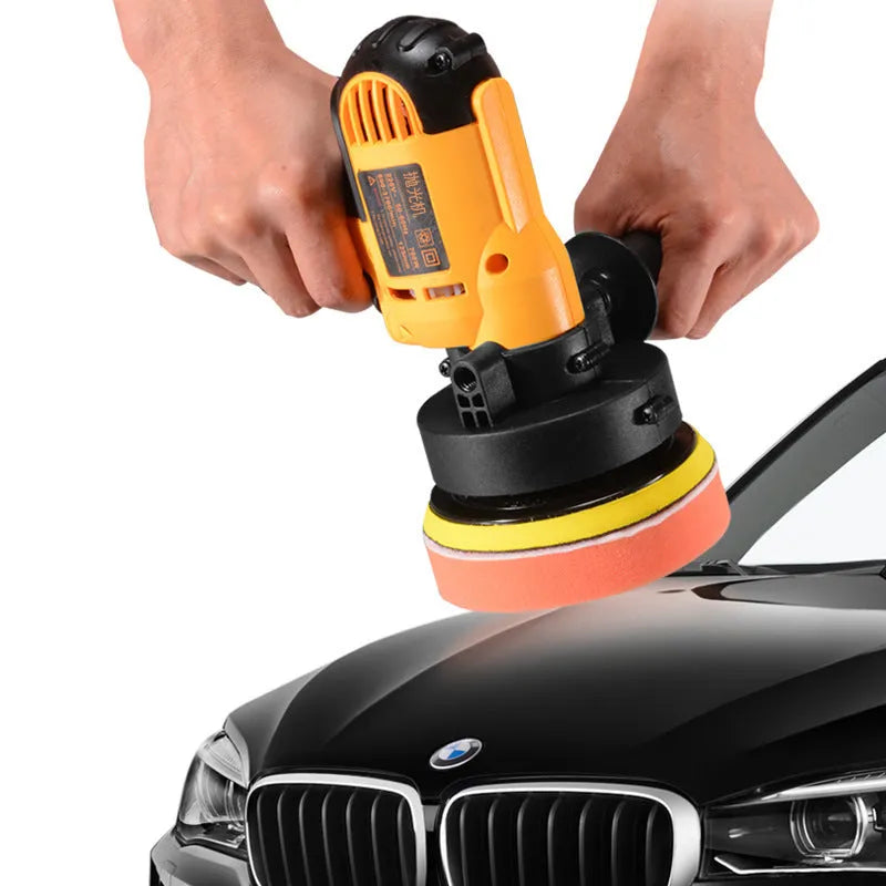 Yellow automotive polishing machine with 125mm disc on workbench