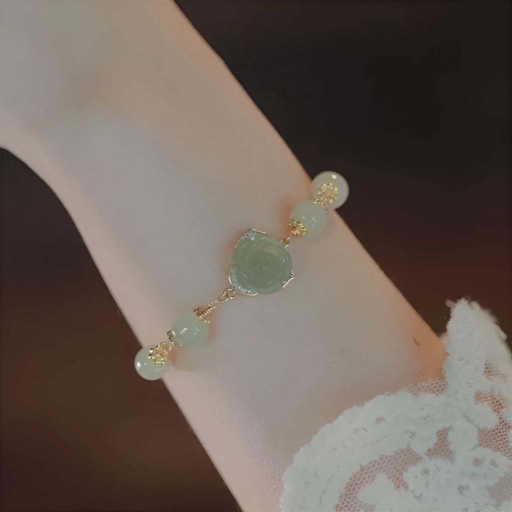 Women's bracelet with Hetian jade rose colour, floral shape, rose elements, and 14K gilded finish.