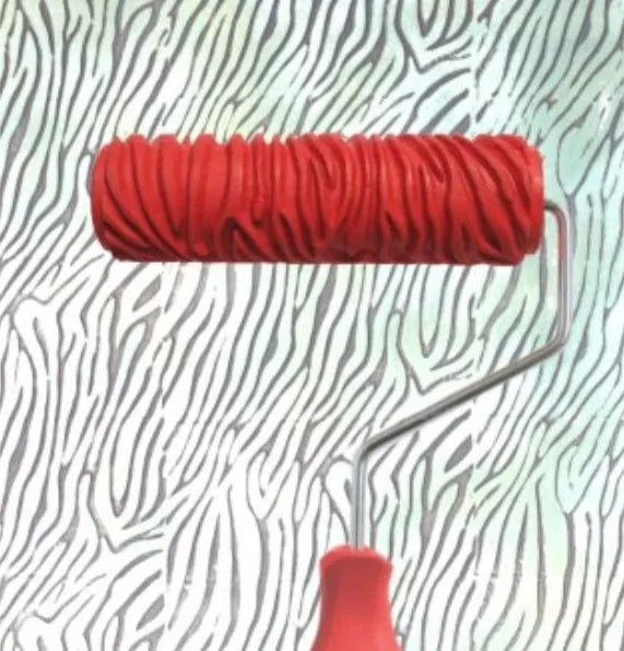 Red 7 inch paint embossing roller with rubber pattern surface for textured wall painting.