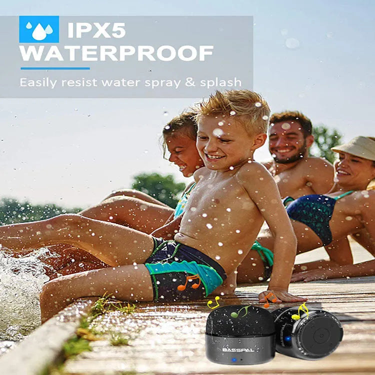 Black waterproof portable mini Bluetooth speaker with buttons for control.