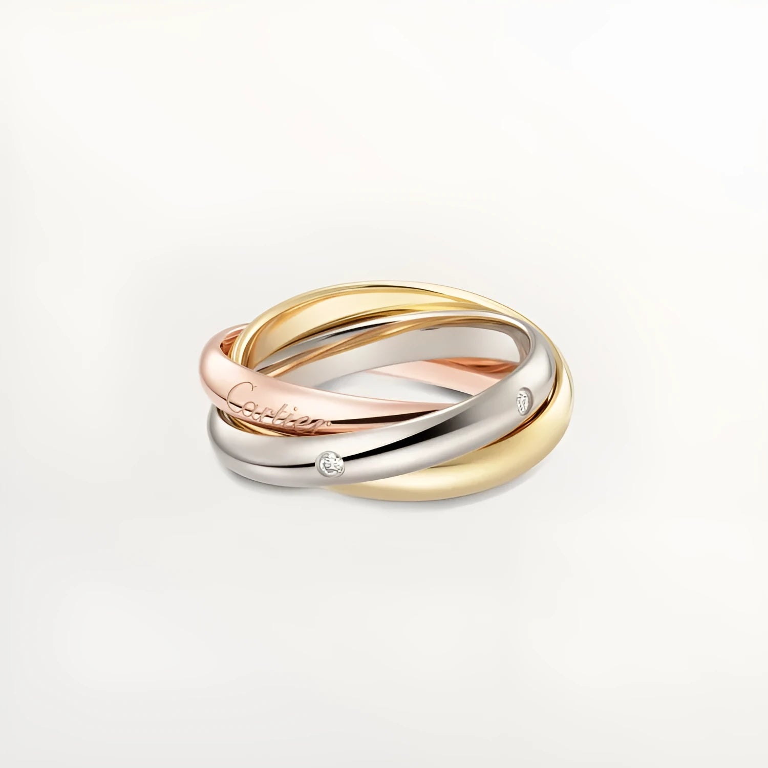 Set of three geometric U-shaped silver couple rings with diamond accents on a grey background.