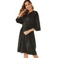 Black A-line midi dress with long sleeves, elastic waist, and a matching fabric belt.