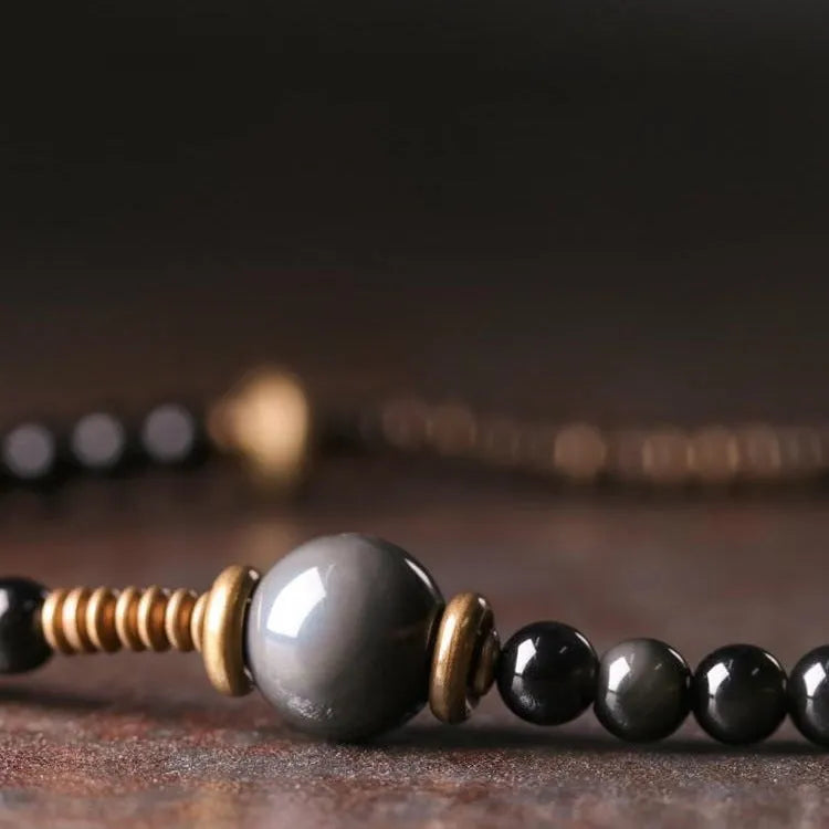 Geometric black beaded multi layered bracelet with natural styling elements