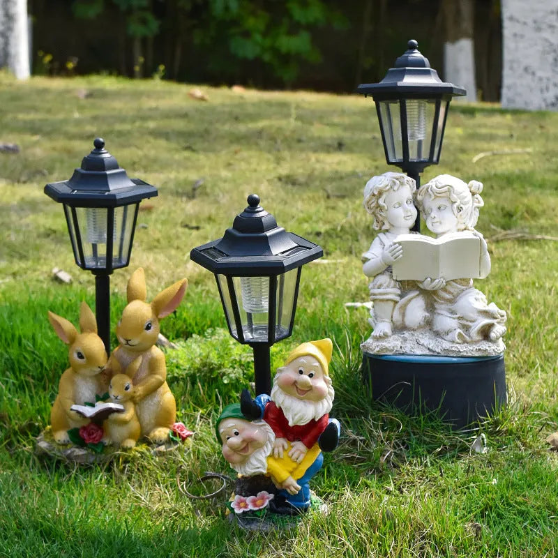 Solar hexagonal garden lamp with resin sculpture decoration in garden setting