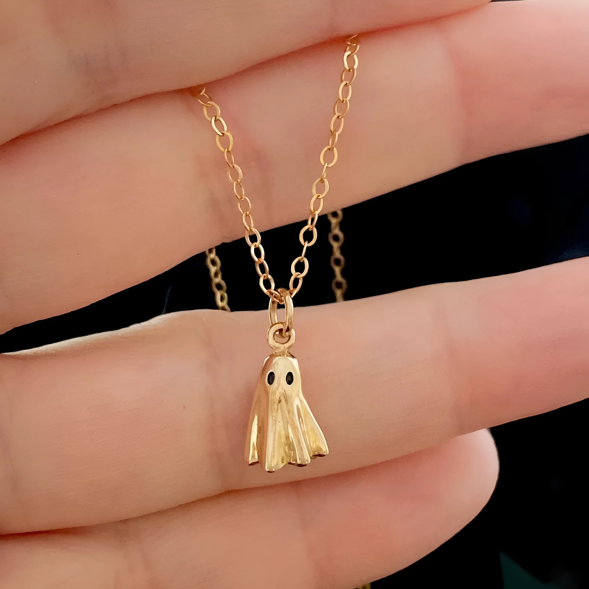 Ghost pendant necklace with twisted stainless steel chain, shown in available chain style options.