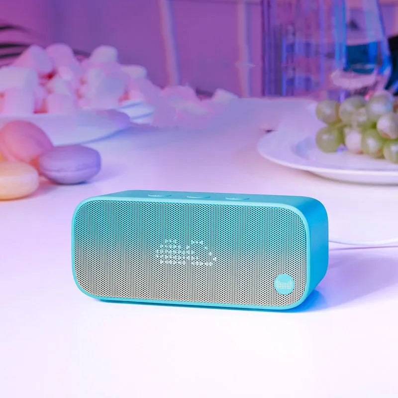 Elf Sugar Cube Artificial Intelligence Smart WiFi Speaker in blue, green, red, or white colour.