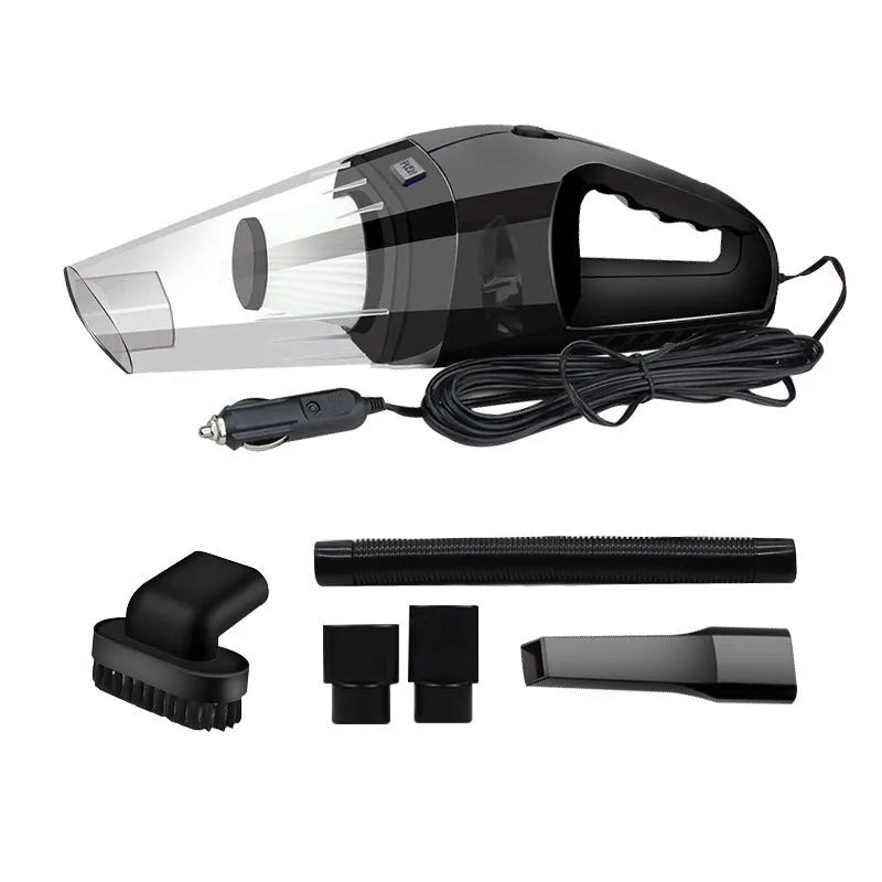 Compact orange handheld vacuum cleaner with nozzle, next to a car's 12V cigarette lighter socket.