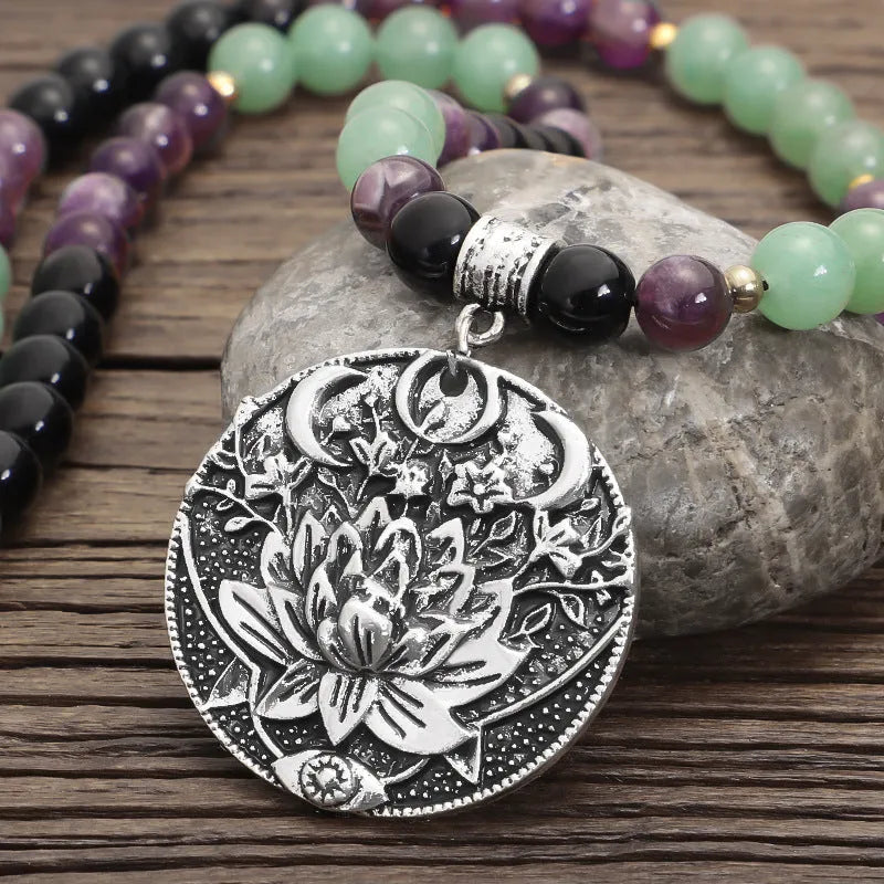 Handmade stone bead necklace with geometric alloy lotus pendant and matching adjustable bracelet.