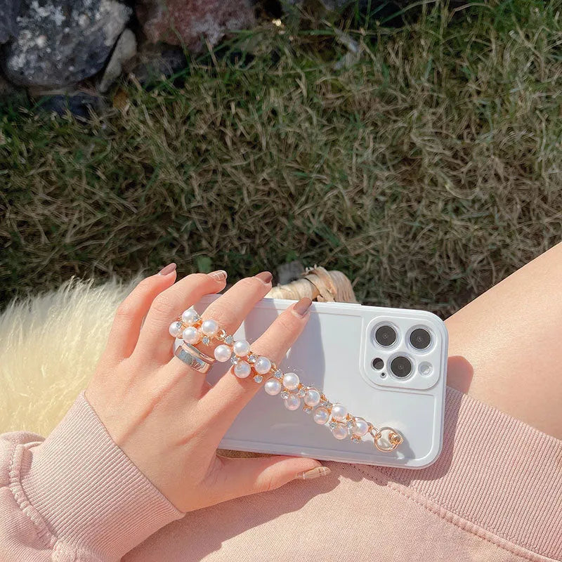 Silicone phone case with rhinestone pearl bracelet for iPhone Pro Max in pink and white options