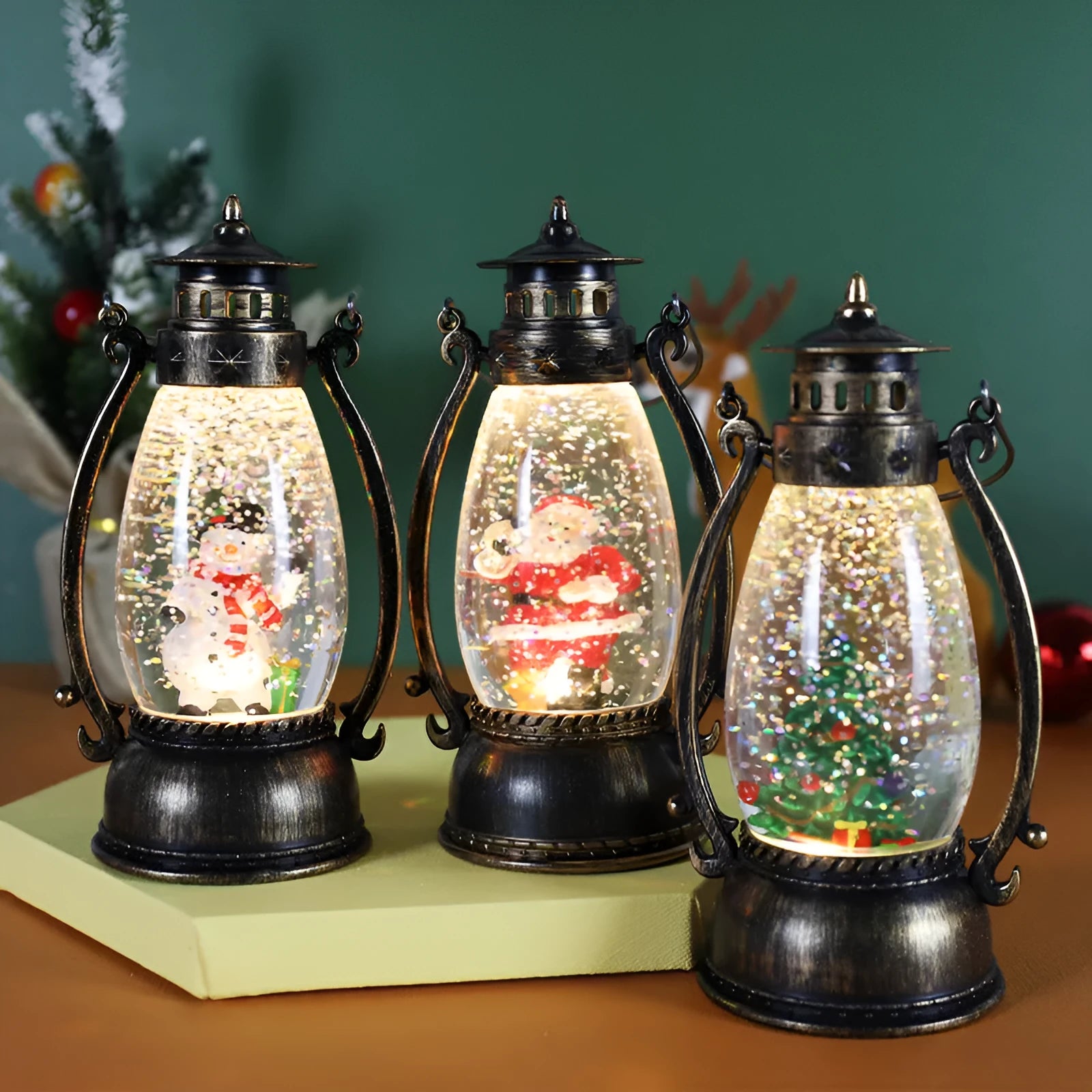 LED light-up crystal ball oil lamp Christmas ornament showing snowman or elderly figure design on a desktop.