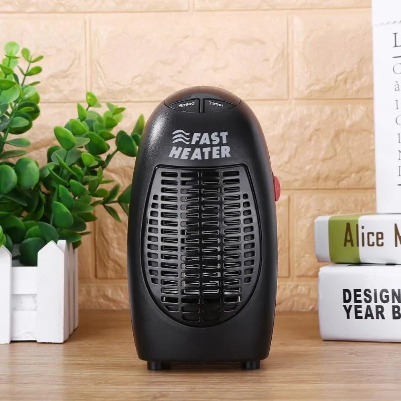 Black mini portable electric heater showing digital display and rotating plug on a white background.