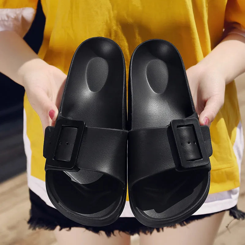 Women's grey blue buckle slippers with a soft EVA sole and single buckle closure.