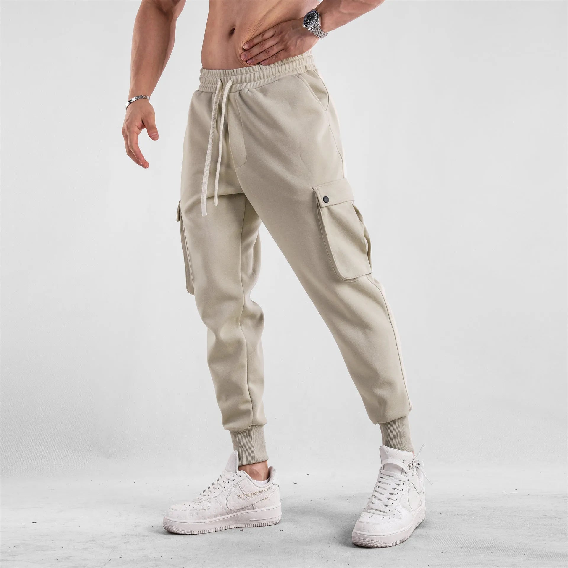 Men's loose cotton sports trousers with ankle-tied cuffs in solid colours