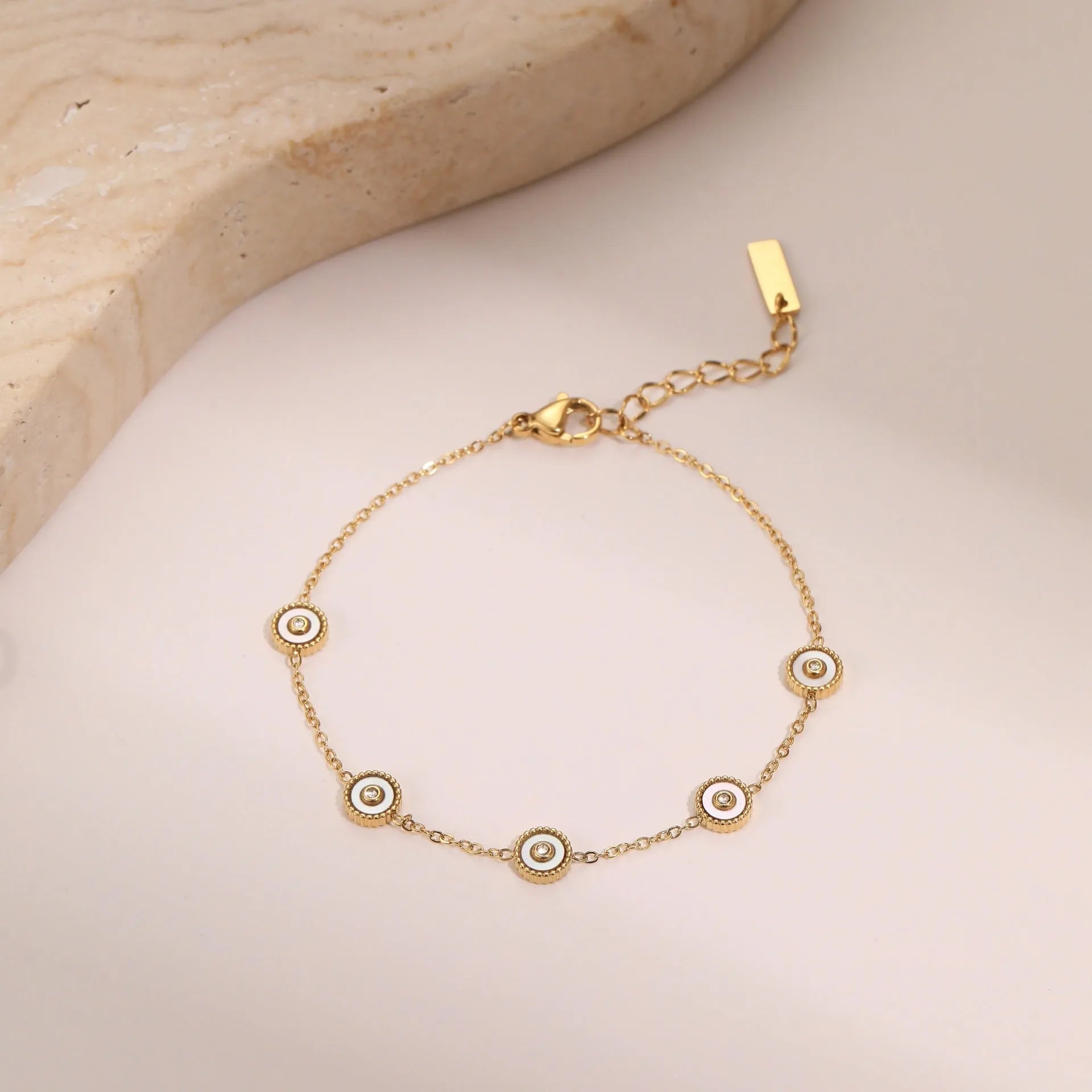 Stainless steel women's bracelet with 18K gold plating and geometric fritillary design