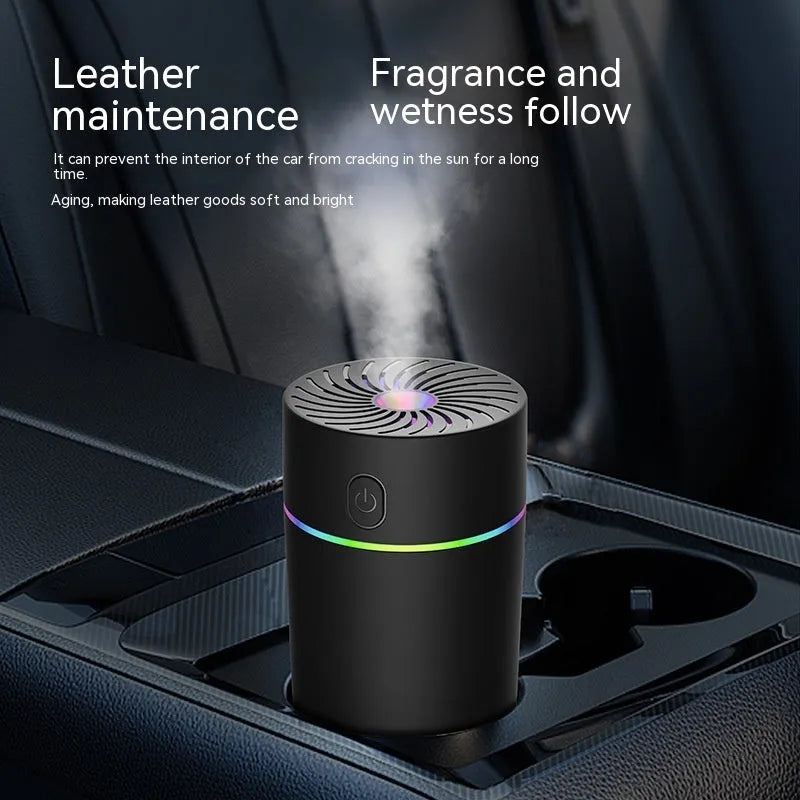 Compact white car USB mini humidifier with aromatherapy function positioned in vehicle cup holder
