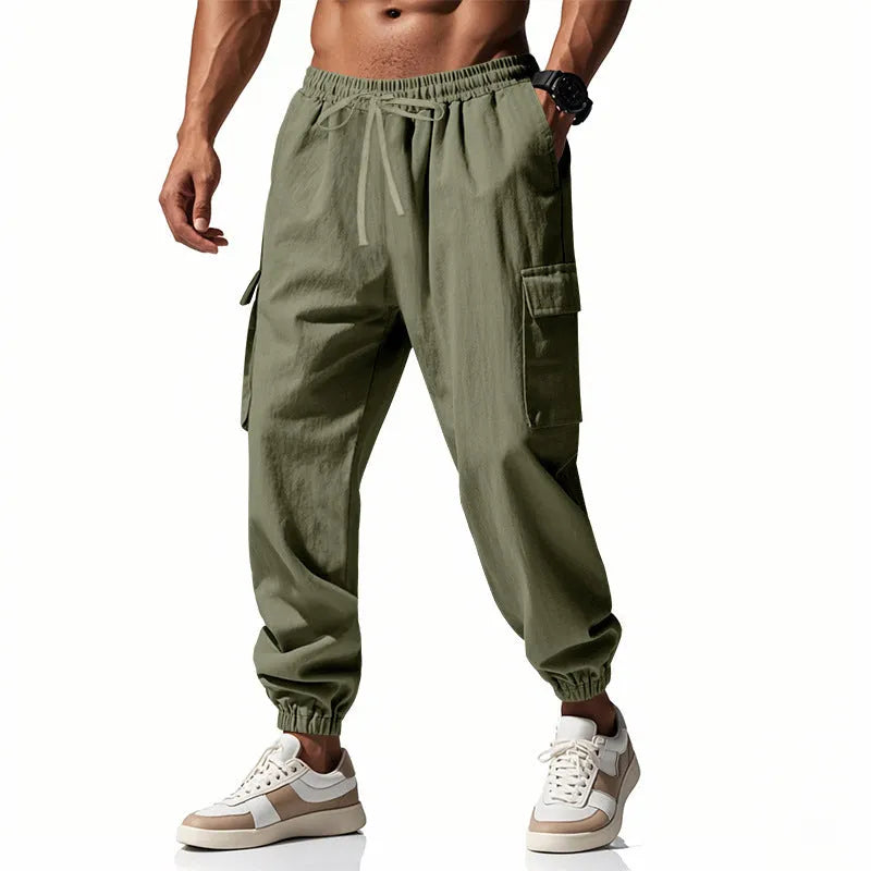 Men's loose linen trousers with ankle tie closure in army green colour.