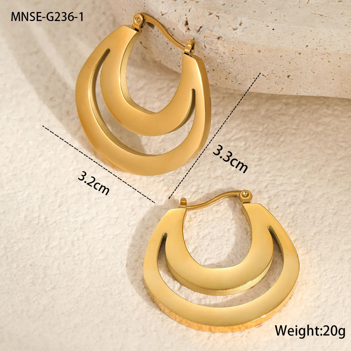Geometric French earrings with gold plating and round ring elements on stainless steel