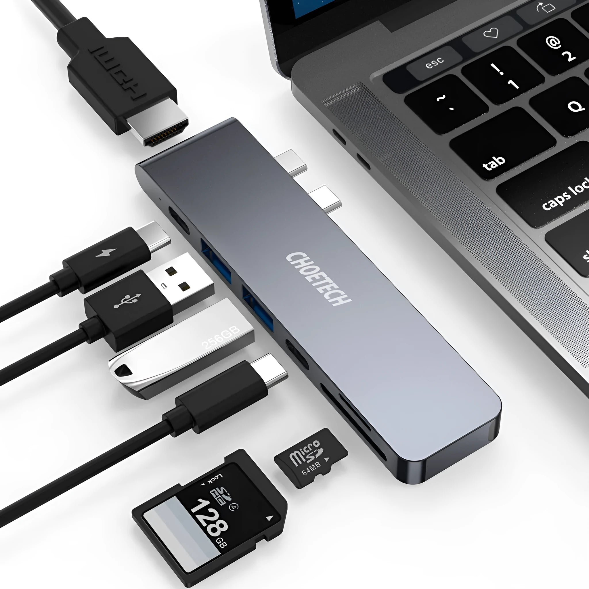 Silver USB-C to multi-port adapter hub with SD card slot, HDMI, USB ports, and PD charging