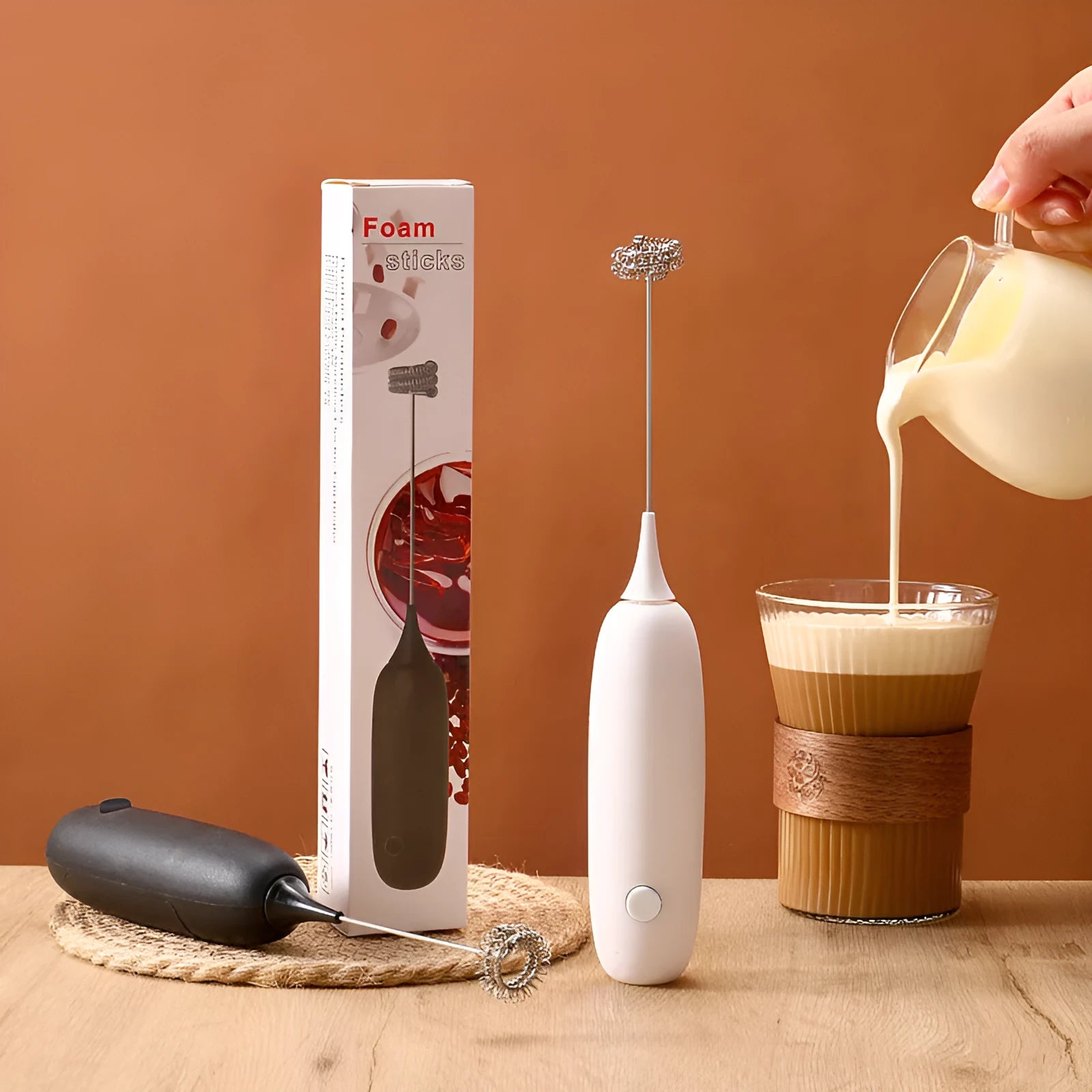 Hand-held electric milk frother blender in black and white colour options