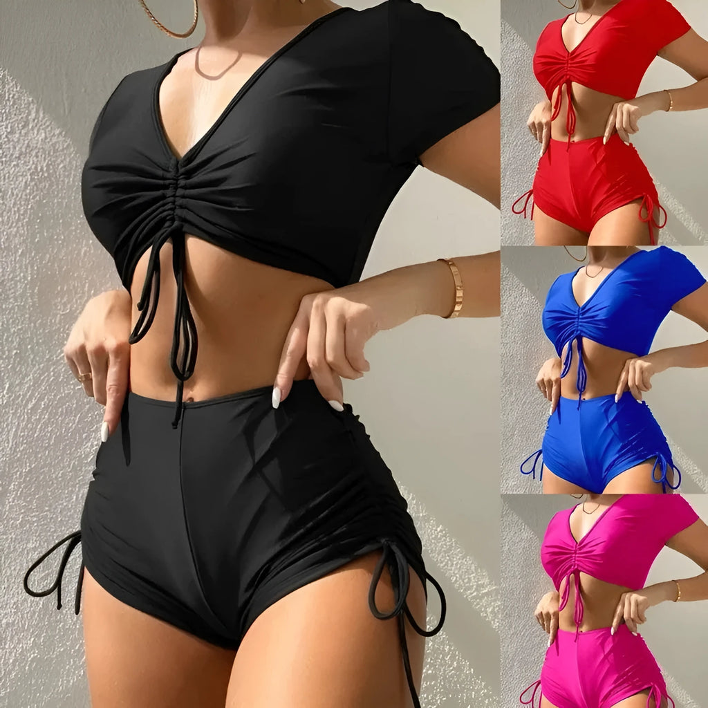 Women's two-piece lace-up bow swimsuit set in dark green, showing top and shorts.