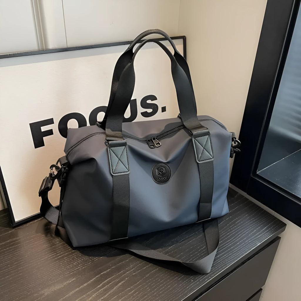 Oxford cloth travel bag in black with 36-55L capacity and waterproof construction for leisure travel