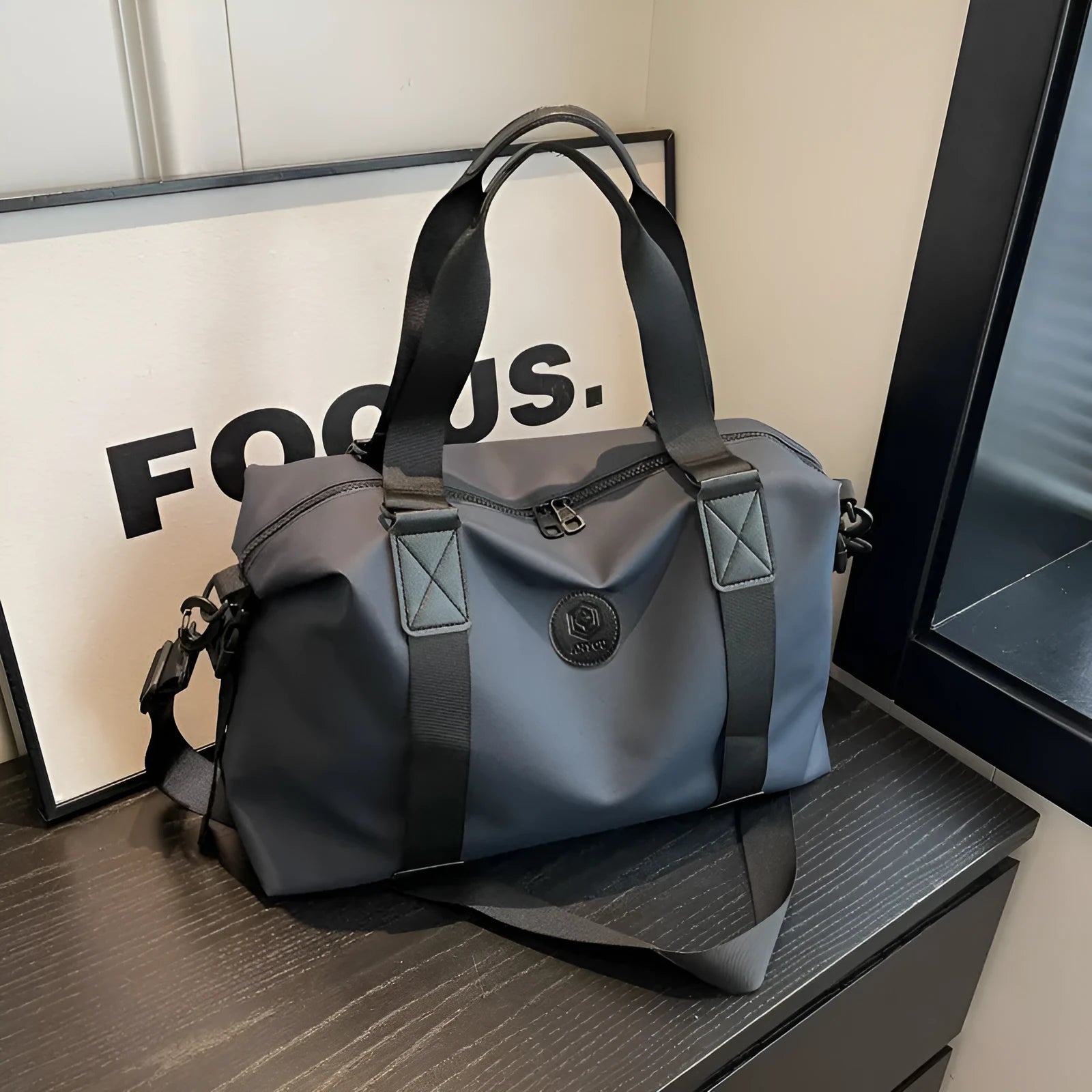 Oxford cloth travel bag in black with 36-55L capacity and waterproof construction for leisure travel
