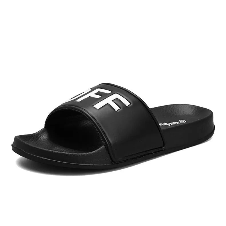 Men's black open-toe rubber slippers showing viscose sole construction