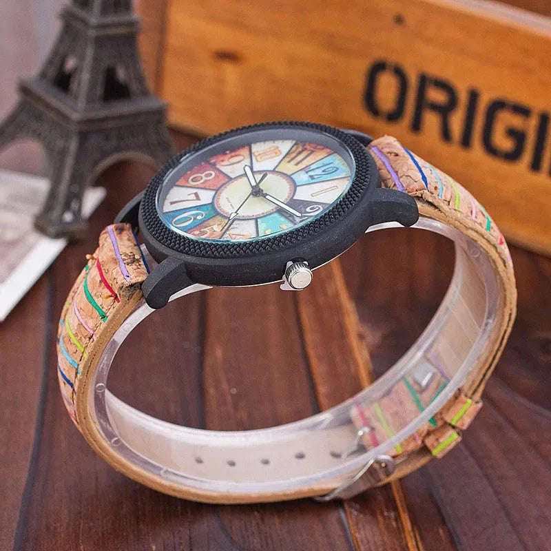 Women's vintage-style quartz watch with brown leather strap and round silver dial
