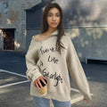 Women's light khaki alpaca wool pullover with loose lapels, turtleneck, and a diagonal front zipper.