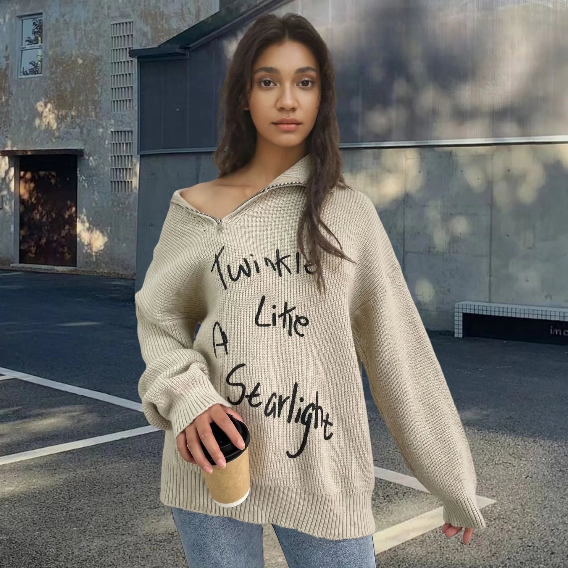 Women's light khaki alpaca wool pullover with loose lapels, turtleneck, and a diagonal front zipper.