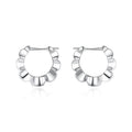 Pair of sterling silver geometric stud earrings with round decorative elements