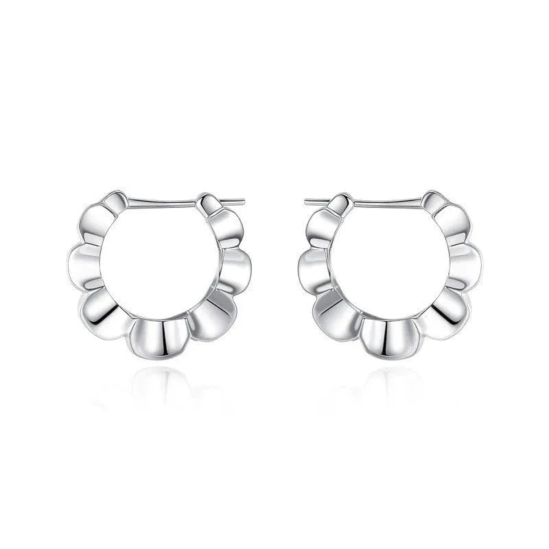 Pair of sterling silver geometric stud earrings with round decorative elements