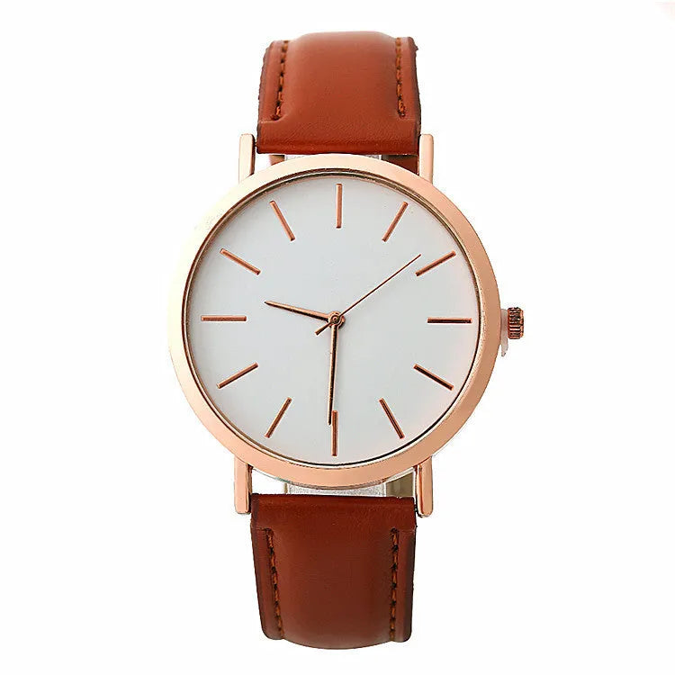 Women's quartz wristwatch round dial 28mm thin case beige strap on white background