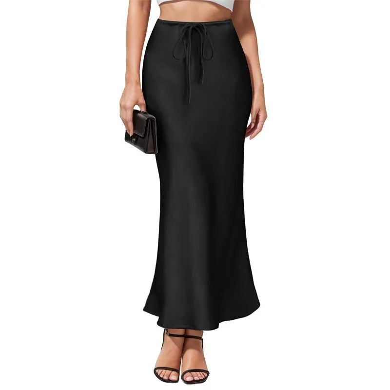 Women's high waist asymmetric acetate skirt with irregular stitching detail in black.