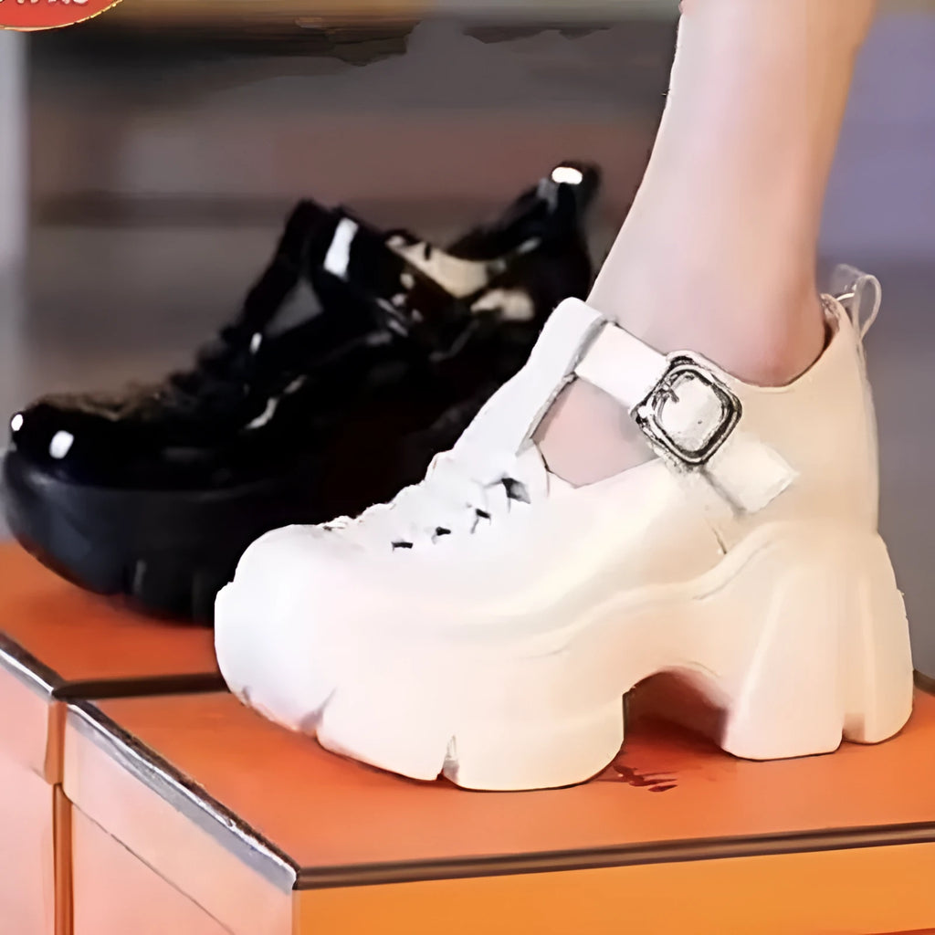 Women's black satin pumps with skull pattern and chunky wedge heel on white background