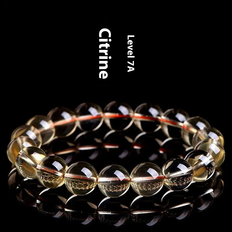 Natural citrine scattered bead ball bracelet showing 7A and 6A colour grades on a model's wrist.