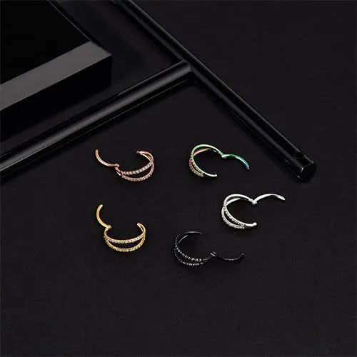 G23 titanium alloy lip ring and nose ring in gold and steel colour on a white background.