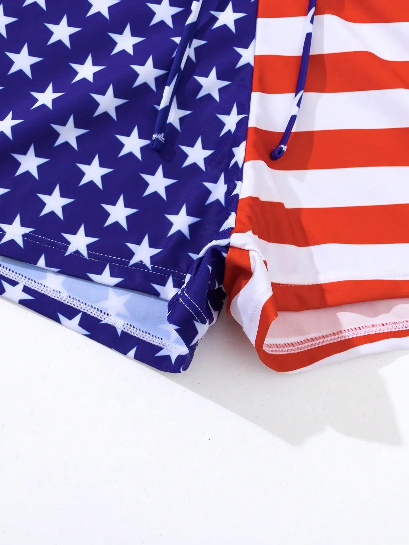 Women's high waist boxer style swimsuit with drawstring in red, white, and blue Stars and Stripes pattern.