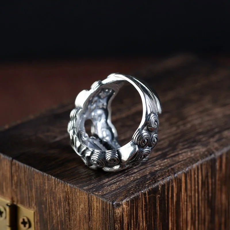 Silver open ring with a personalised diamond jibeast animal zodiac pattern on a hand.