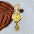Women's stainless steel watch with round dial in gold, black gold, or white gold finish.