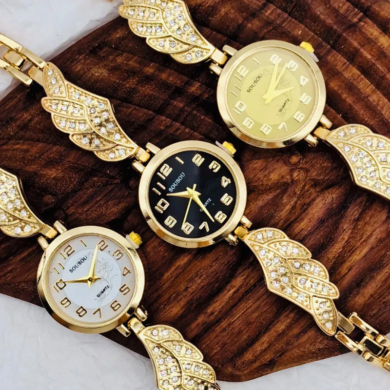 Women's stainless steel watch with round dial in gold, black gold, or white gold finish.