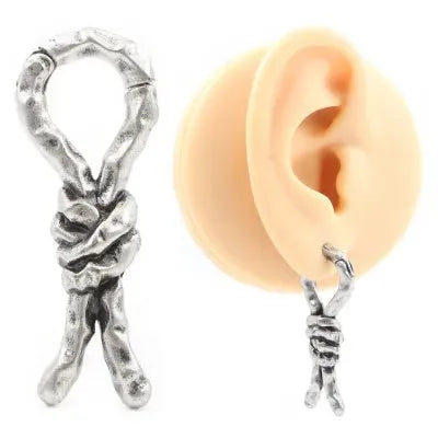 Close-up of a 4mm copper earring with a bends and hitches design for auricle piercing.