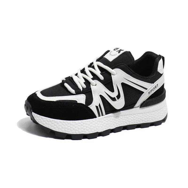 Women's black casual flat shoes with round toe and front lace-up design on a plain background.