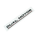Tesla Model 3 dual motor performance sticker in black and red on a car bumper