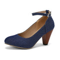 Blue denim women's ankle boots with a buckle strap and thick platform heel on a rubber sole.