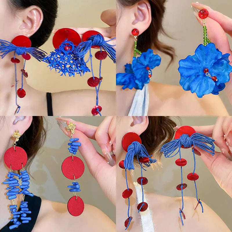Women's geometric fabric earrings with blue resin flower detailing and silver needle colour