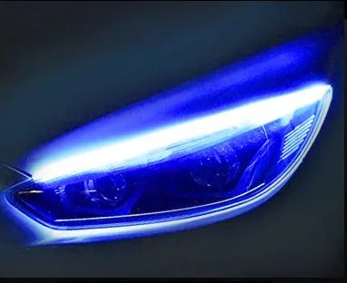 Car LED daytime running light strip with flowing turn signal indicator in silicone housing