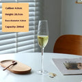 Six French champagne glasses with beaded decoration in various crystal colour finishes